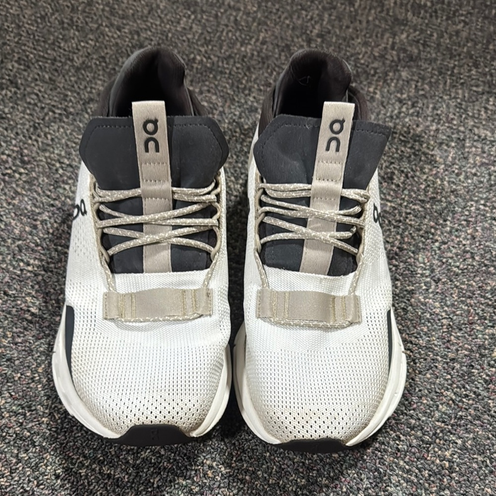 On Running Black and White Athletic Shoes with Sock-Like Collar